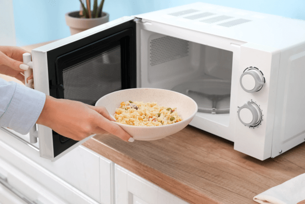 A microwave oven is used to heat food through radiation heat transfer.-min