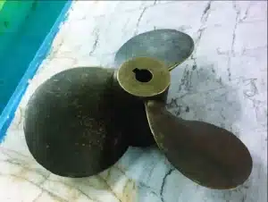 A 3D digital representation of the famous DTMB 4119 ship propeller, showing the four metal blades designed for marine travel.