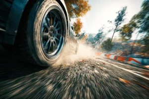 Car wheel motion on gravel and sand road, showing the initial 3D geometry of the tire and the granular terrain.